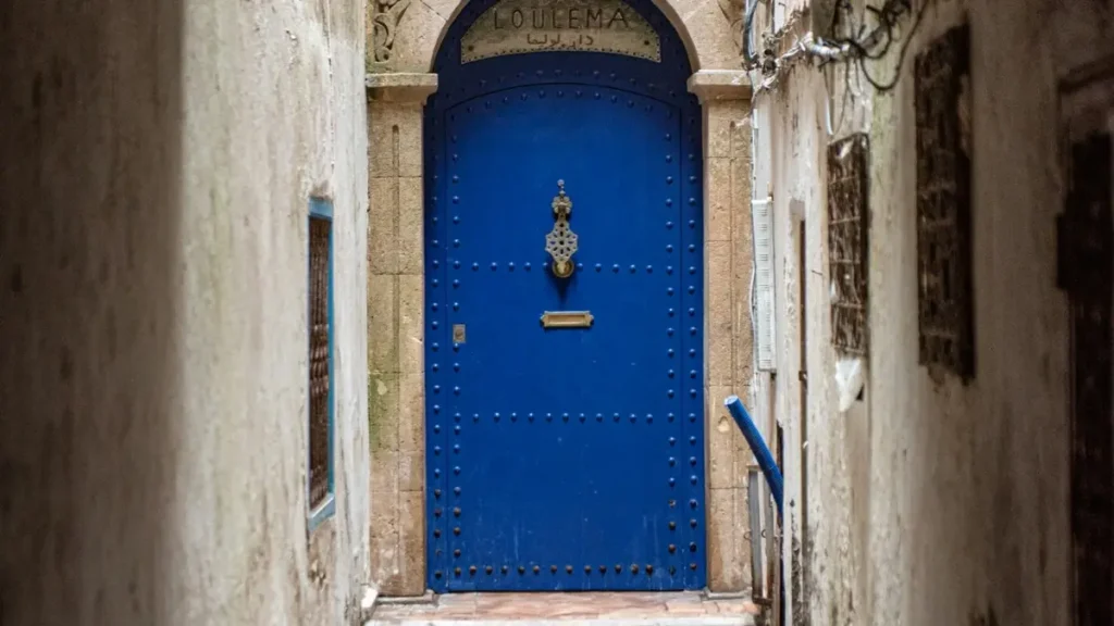 Traditional blue riad doorway in Essaouira Medina