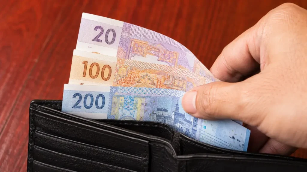 Moroccan dirham banknotes in a wallet, showing cash used for everyday payments in Morocco
