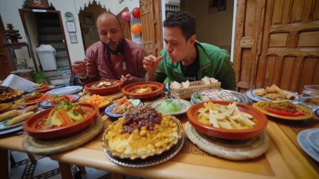 What to eat in Morocco: traditional tagines, salads and bread shared at a local meal