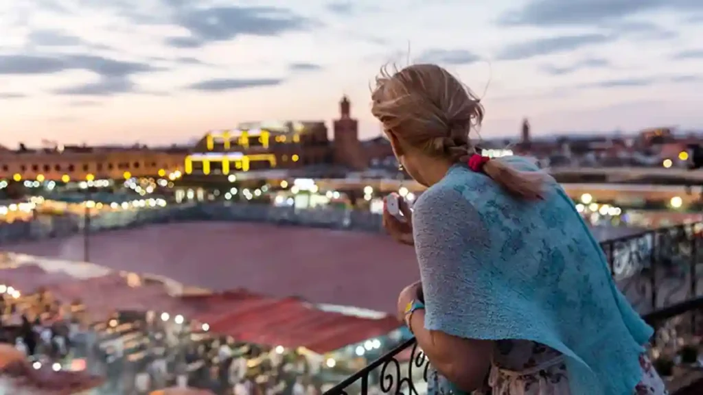 solo female traveler in marrakech at sunset