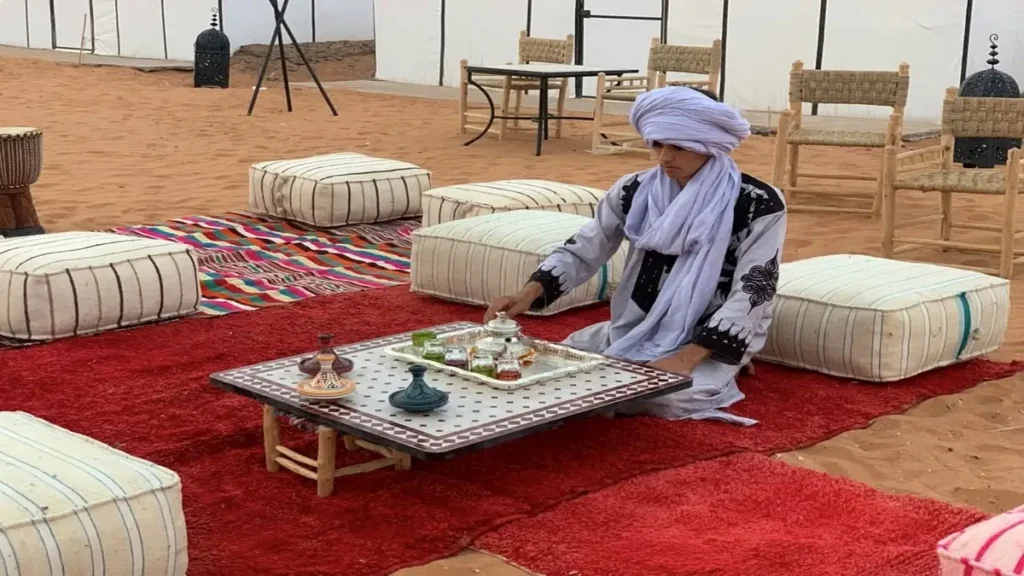 Traditional Moroccan tea served at a desert camp in the Sahara, a typical experience when staying overnight in the dunes