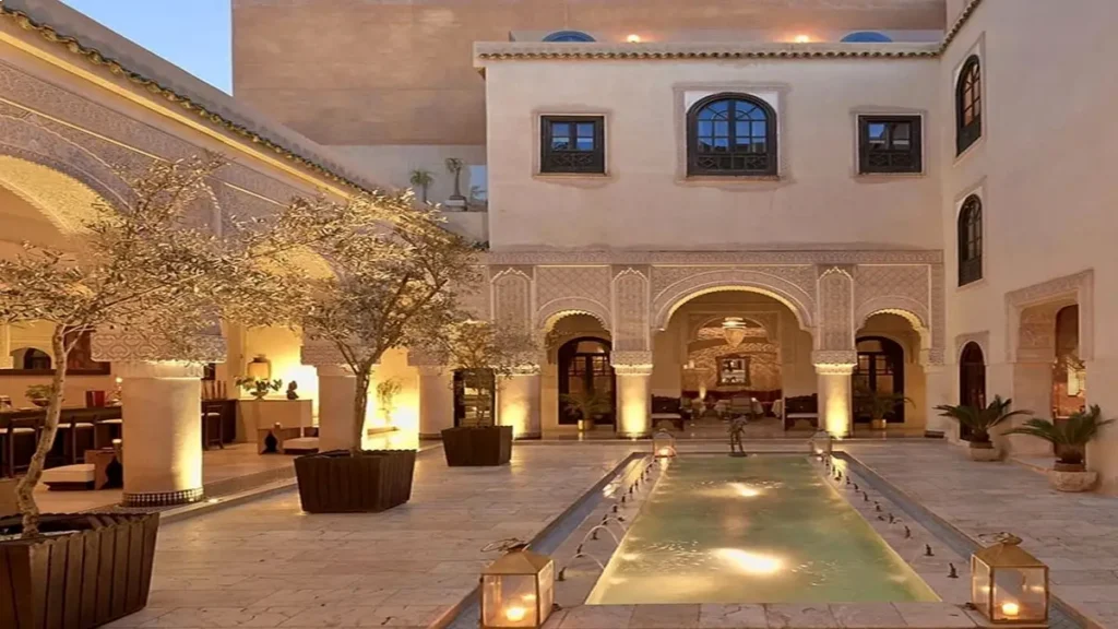 Traditional riad courtyard in Marrakech Medina with fountain and arches, a popular accommodation style for visitors