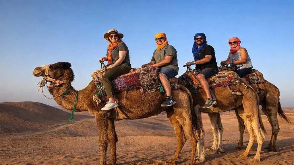 Tourists riding camels in the Agafay Desert near Marrakech