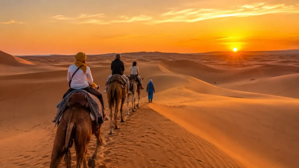 Sahara Desert Morocco in June with golden dunes, camel ride, and sunset near Merzouga