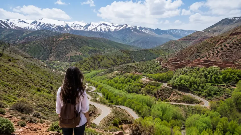 April Morocco travel guide view of green Atlas Mountains with snow peaks and spring valleys