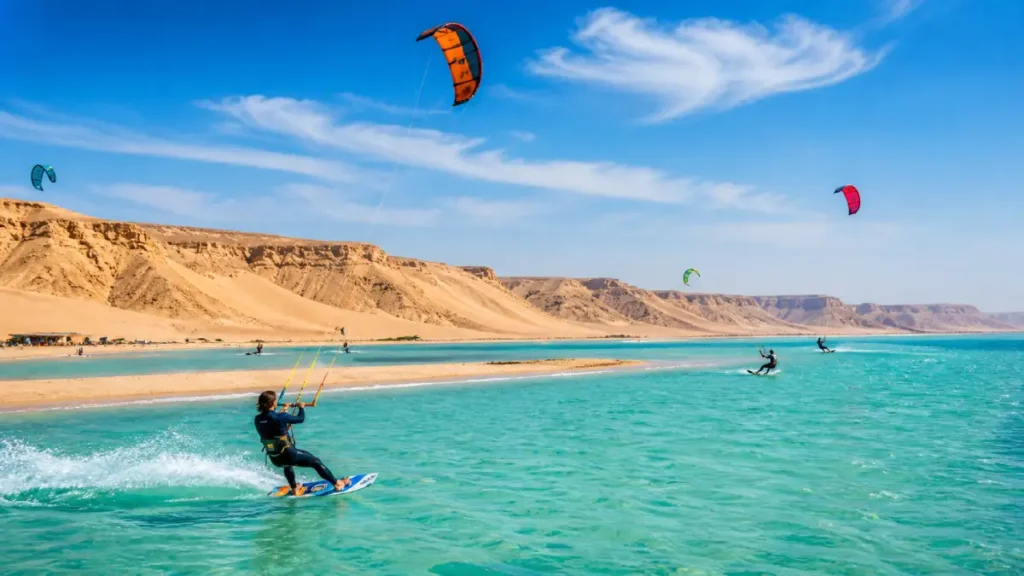 Dakhla Lagoon Morocco kitesurfing on turquoise water with desert dunes