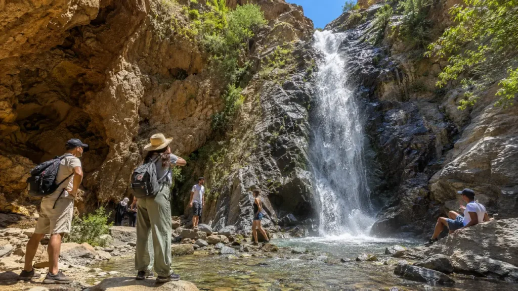 Ourika Valley waterfall hike near Setti Fatma with travelers exploring rocky mountain scenery on a day trip from Marrakech