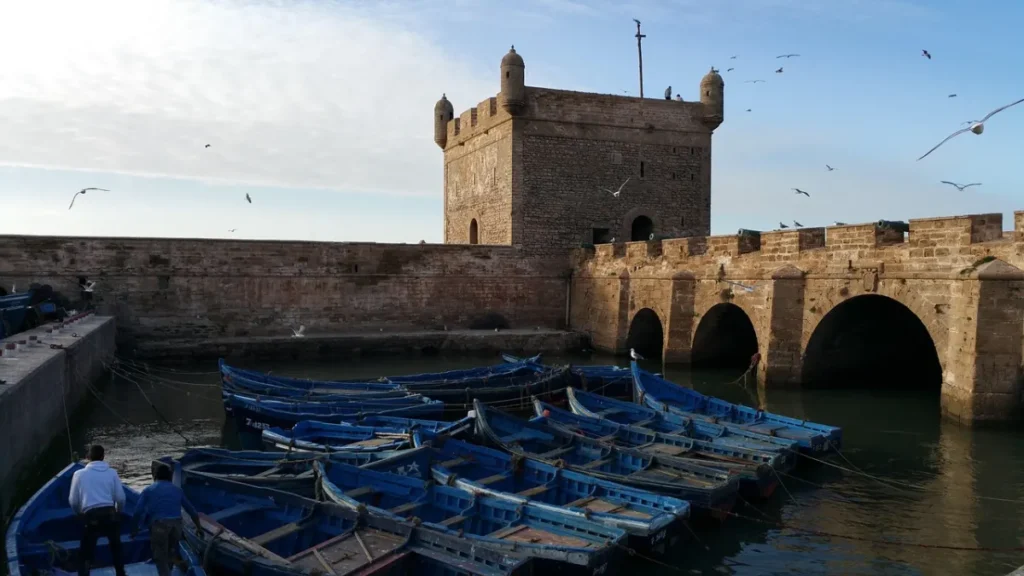 Essaouira ramparts and blue fishing boats on a day trip from Marrakech