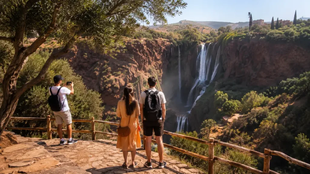 Ouzoud Waterfalls viewpoint in Morocco with travelers looking over the canyon and cascades