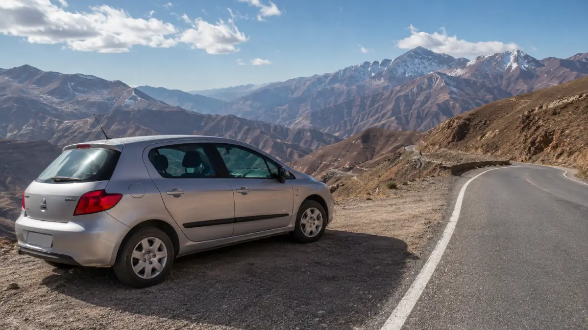 Rental car on a scenic road in the High Atlas Mountains in Morocco