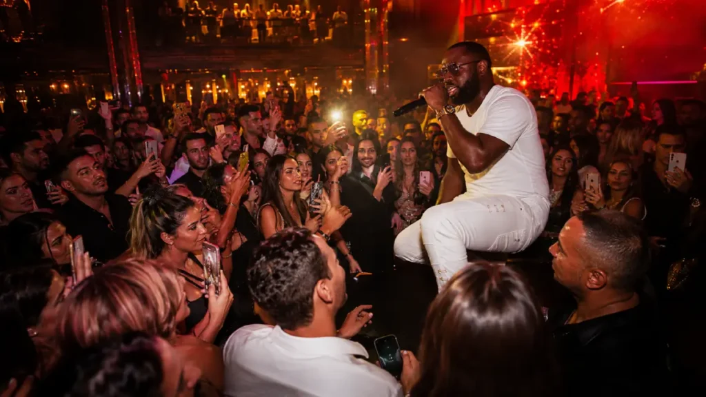 Marrakech nightlife at 555 Famous Club with a live performer and nightclub crowd