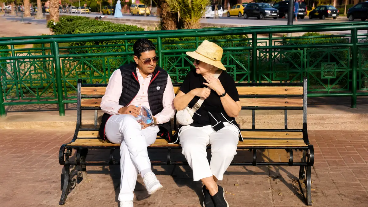 Kamal El Otmani, founder of Morocco Tips, speaking with a traveler in Marrakech