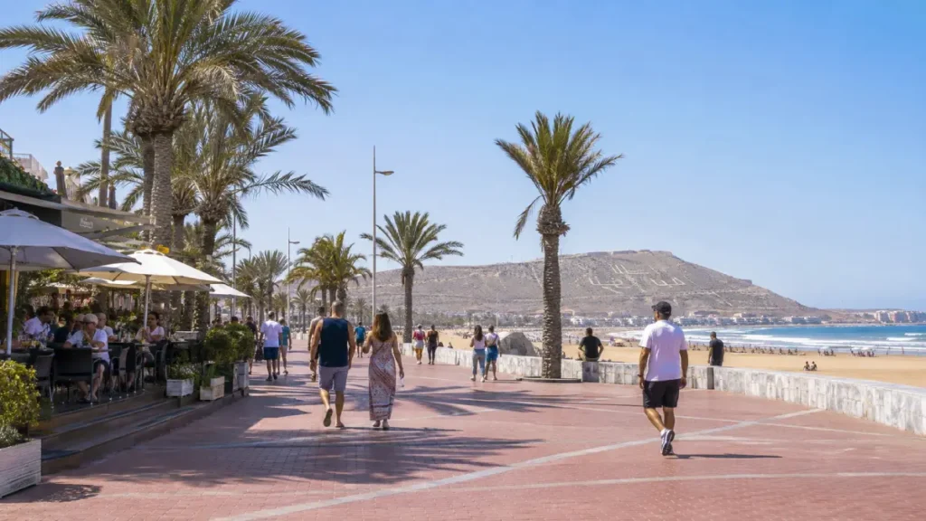 Agadir beach promenade with palm trees and Atlantic Ocean