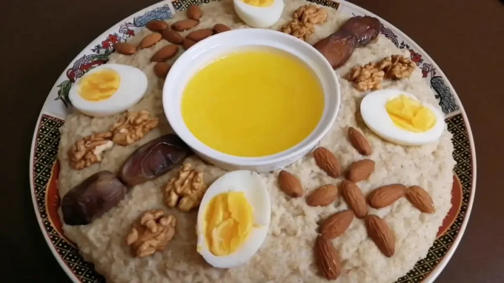 Traditional Tagoula dish served with dates, almonds and walnuts in Morocco