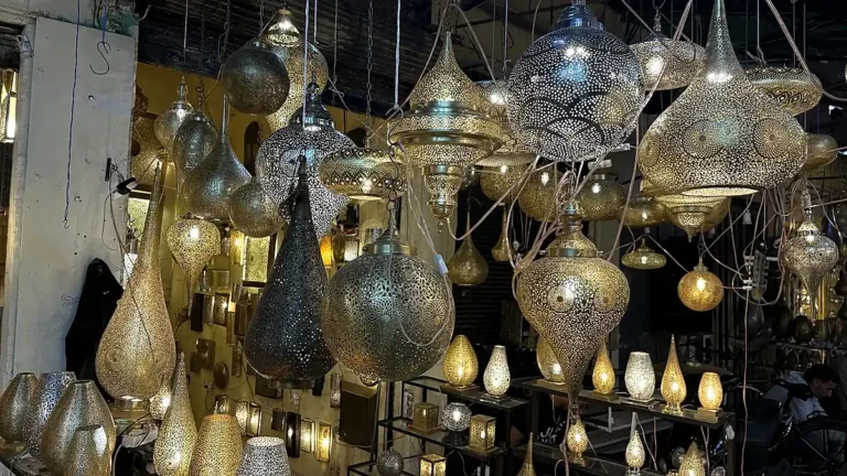 Buying lanterns in Marrakech: hanging metal lanterns displayed in a shop