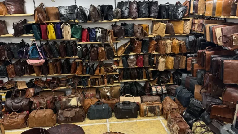 Buying leather in Marrakech: leather bags displayed on shop shelves