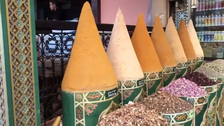 Buying spices in Marrakech: colorful spice pyramids outside a shop