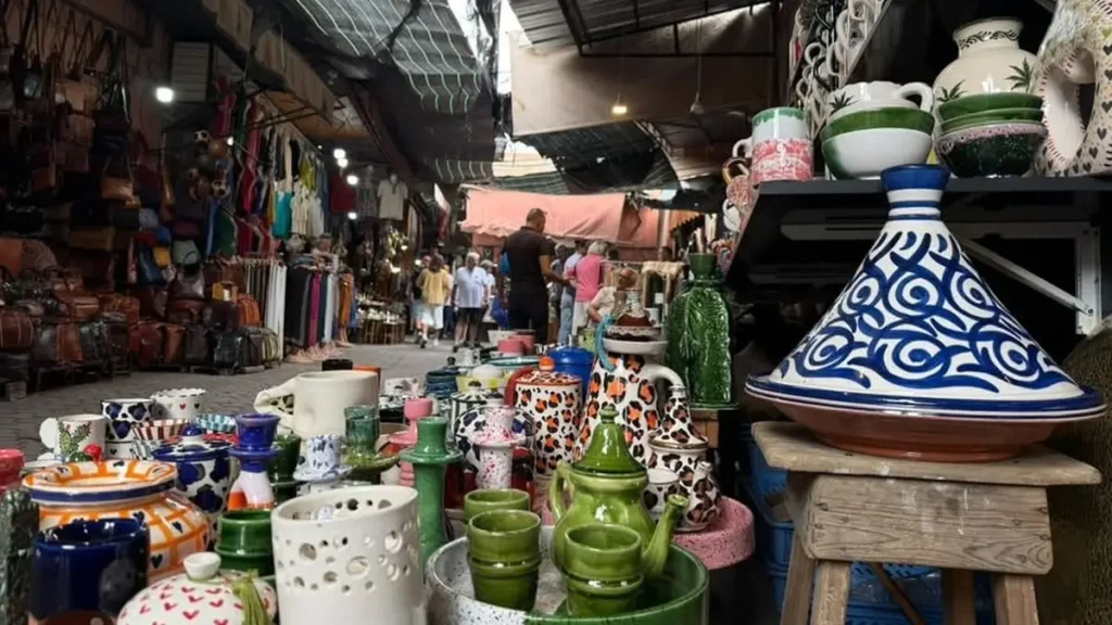 Marrakech ceramics shop displaying colorful bowls, cups and a blue-and-white tagine