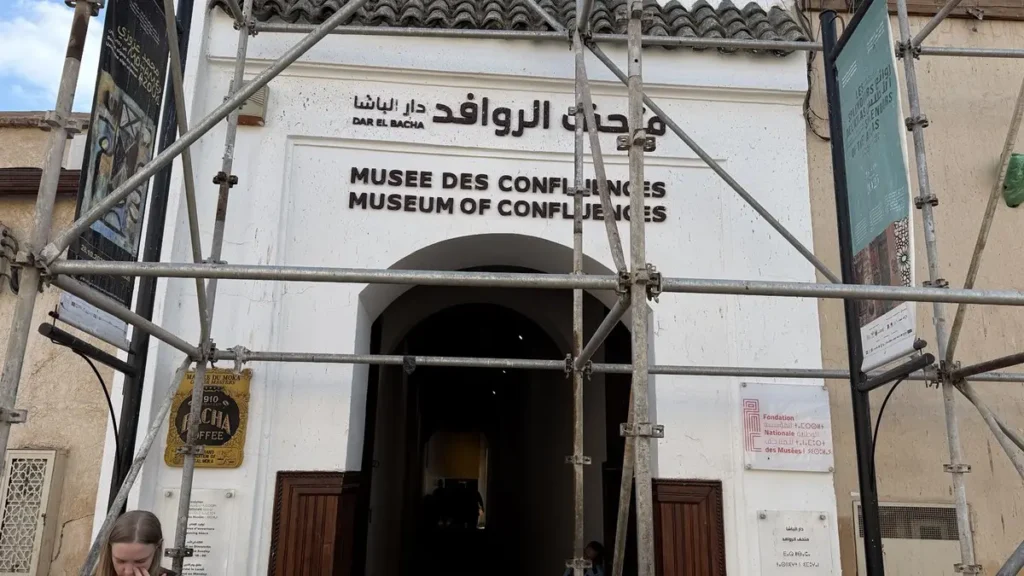 Entrance to Dar El Bacha Museum of Confluences in Marrakech, with scaffolding across the façade
