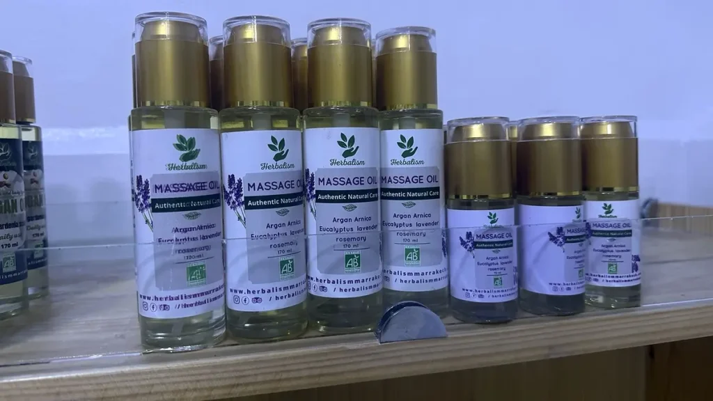 Massage oil bottles labeled with argan, arnica, eucalyptus, lavender and rosemary