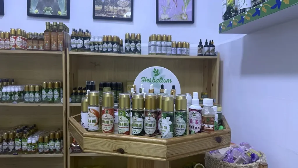Argan oil bottles and cosmetic products displayed inside a Marrakech shop