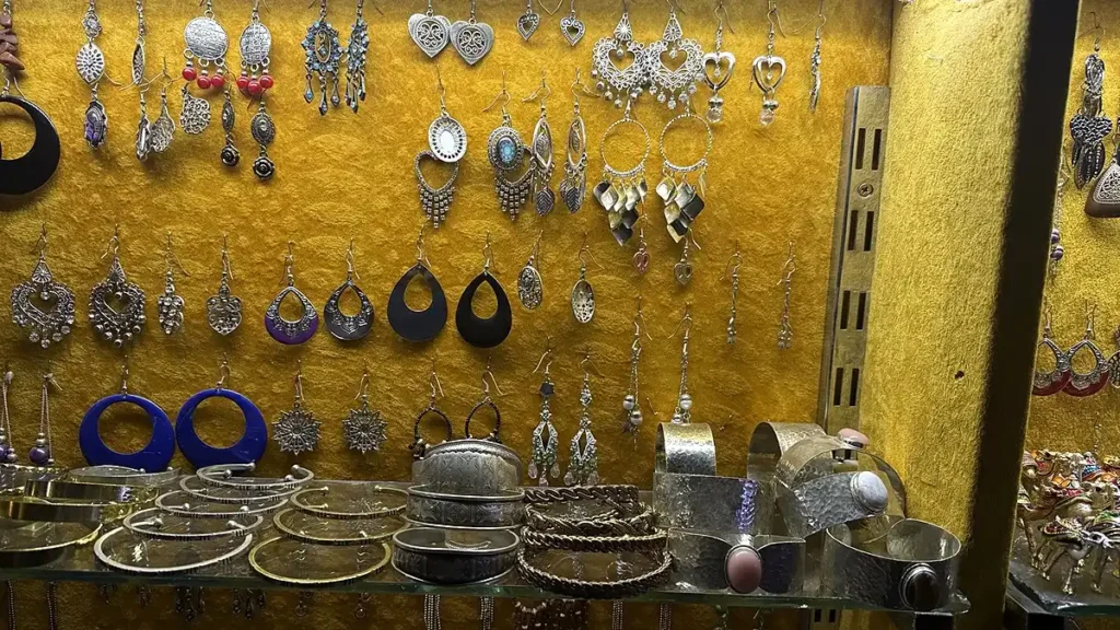 Earrings and metal bracelets displayed in a Marrakech jewelry shop