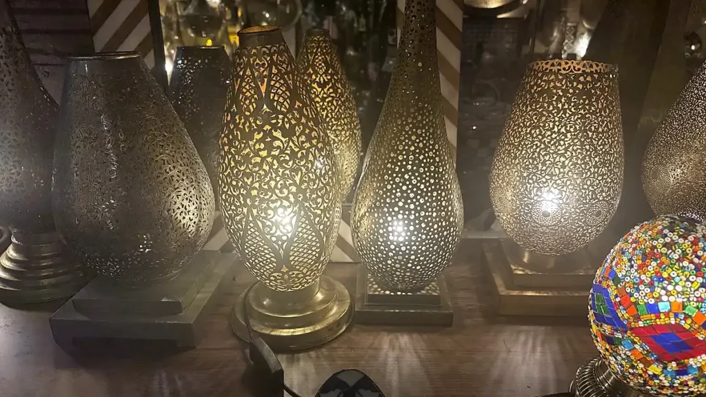 Illuminated metal table lamps with floral and dotted patterns