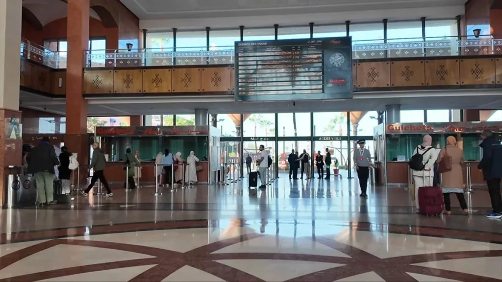 Ticket counters and departure board inside Marrakech railway station