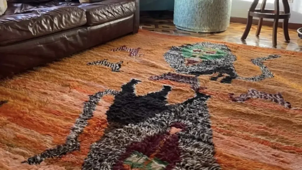 Orange patterned rug beneath furniture in a living room