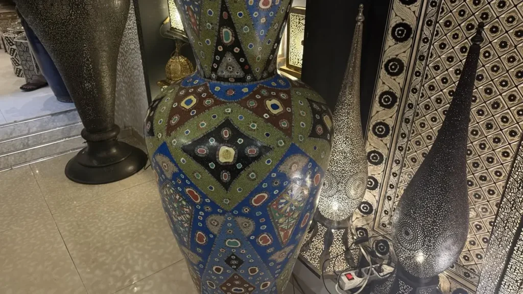 Colorful patterned ceramic vase displayed in a Marrakech shop